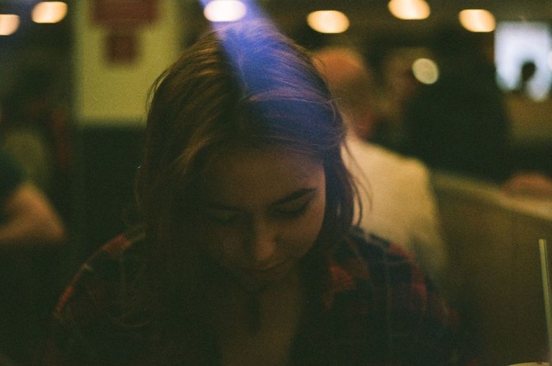 Close-up of woman at night
