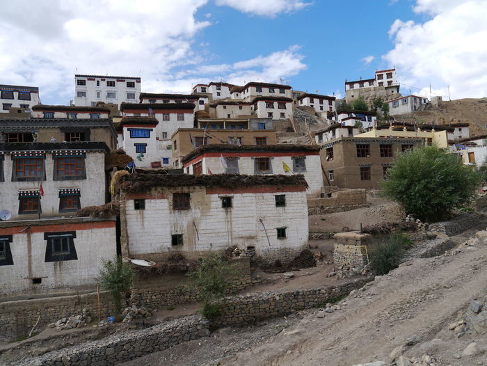 Slum in against cloudy sky
