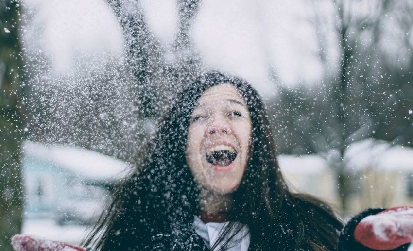 Young woman enjoying in snow