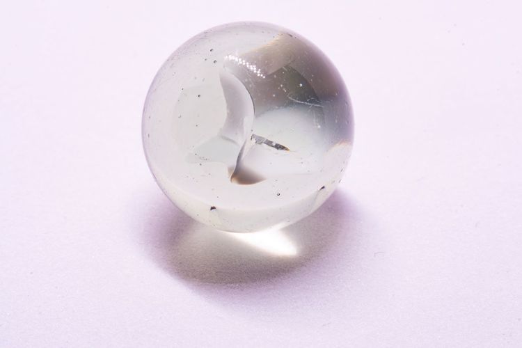 Close-up of glass over white background