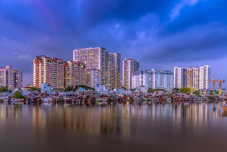 Panoramic view of river and buildings against sky