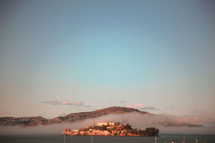 Scenic view of the alcatraz prison  against sky during sunset