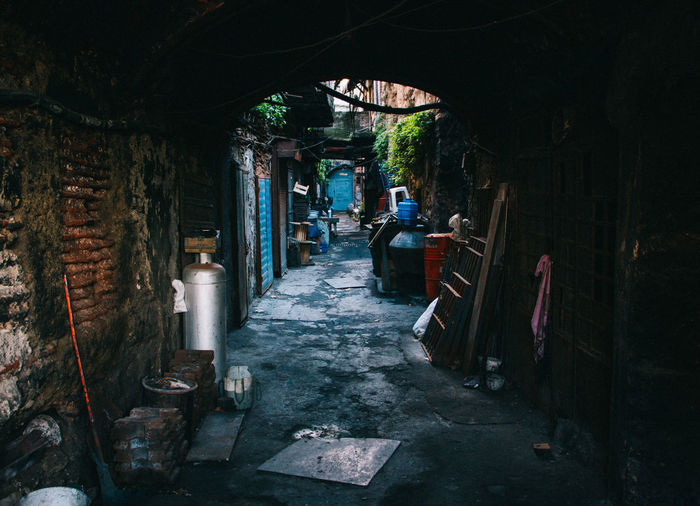 Empty footpath amidst slums