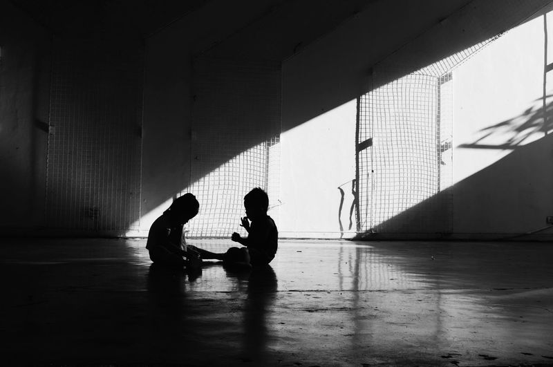 People sitting on wall
