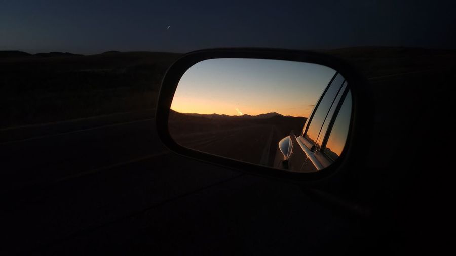 View of sunset in side view mirror