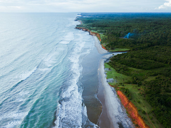 View of the beach air during the day with beautiful waves in bengkulu, indonesia
