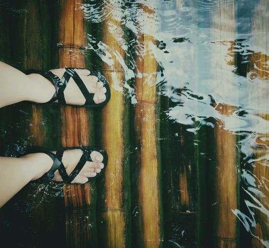 Low section of woman in water