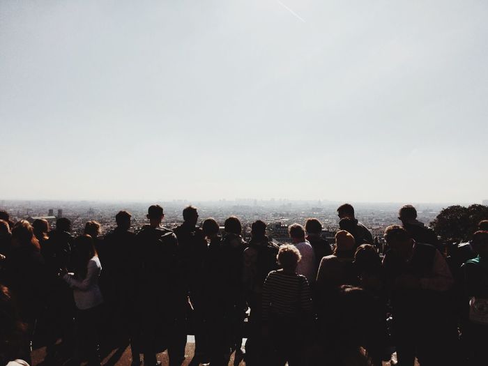 Crowd at observation point against clear sky