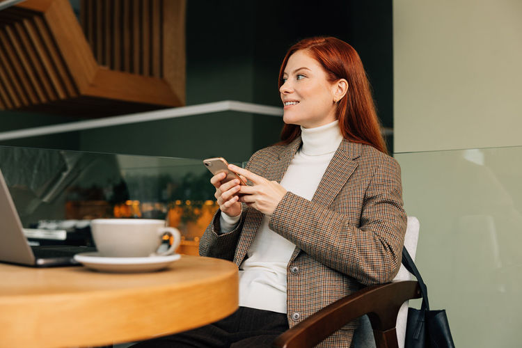 Young woman using mobile phone