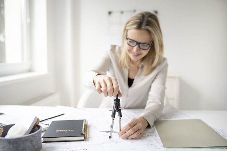 Woman working on table in office