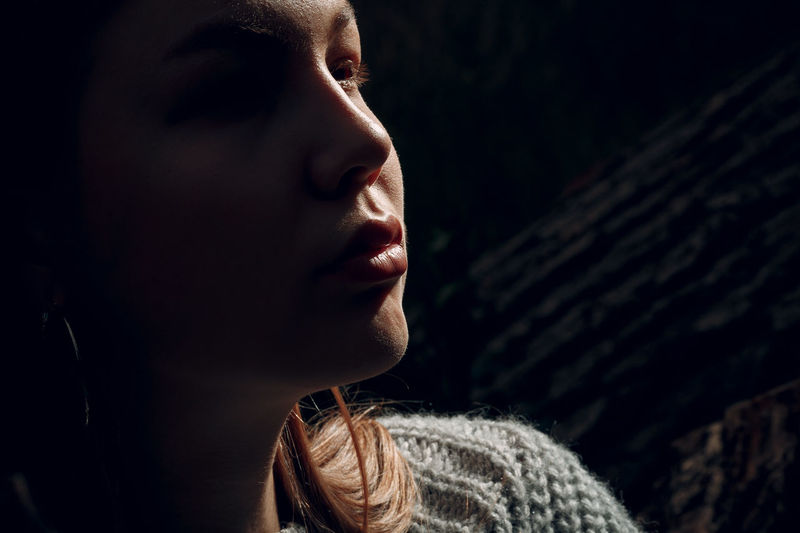 Close-up portrait of woman looking away