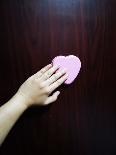 Holding a heart shape 