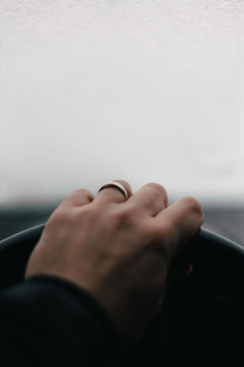 Close-up of man hand on car