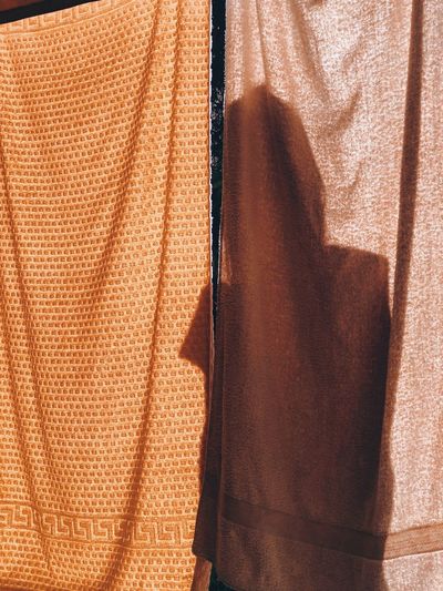 FULL FRAME SHOT OF CURTAIN HANGING ON FABRIC