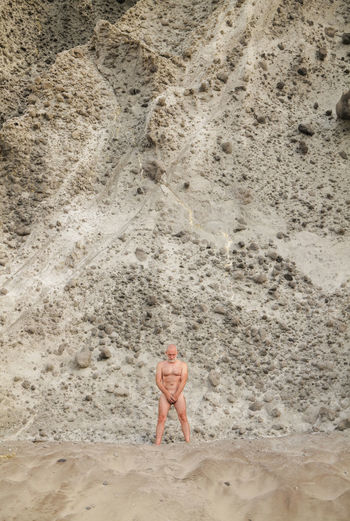 High angle view of man standing on beach