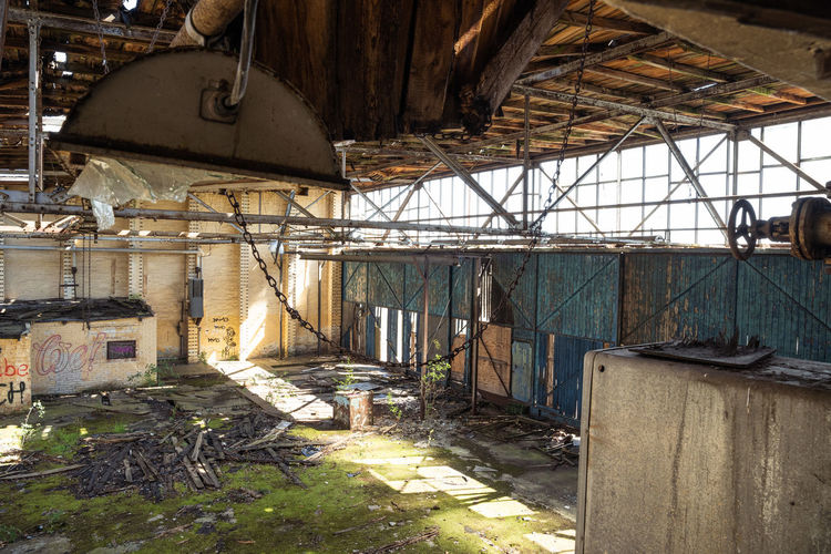 Abandoned building seen through broken ceiling