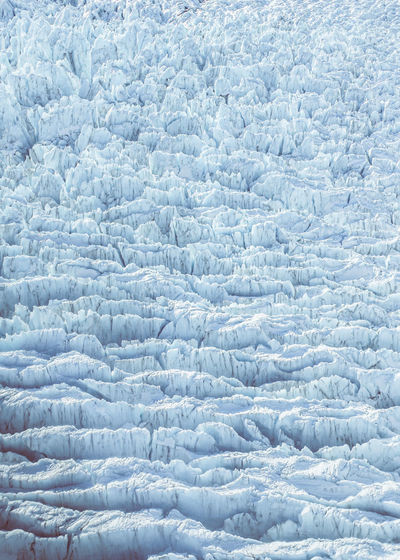 Glacier aerial view filling whole frame with ice.