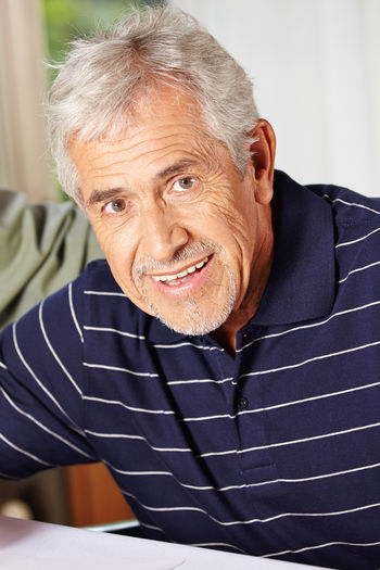 Portrait of smiling man at home