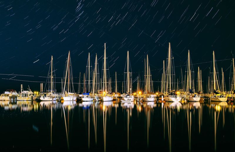 Scenic view of boats moored at harbor