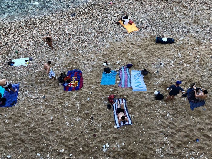 High angle view of people playing on beach