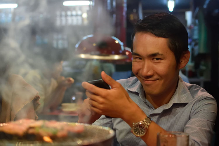 Man holding ice cream in restaurant