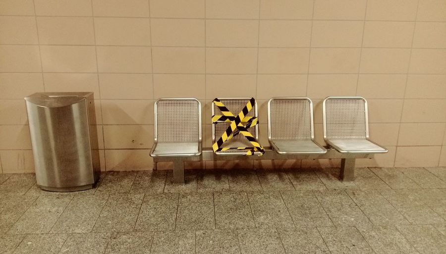 Empty chairs at underground walkway