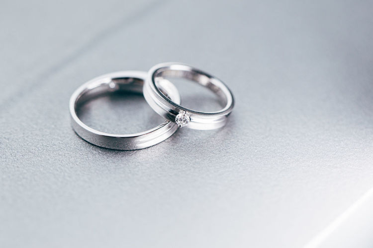 High angle view of platinum wedding rings on table