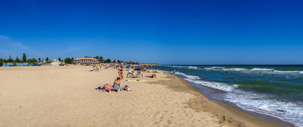 Deserted beach in the the village of rybakovka, odessa region, ukraine, on a sunny summer day