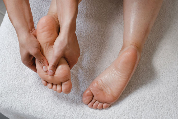 Foot spa massage treatment by professional massage therapist in spa resort. wellness, stress relief
