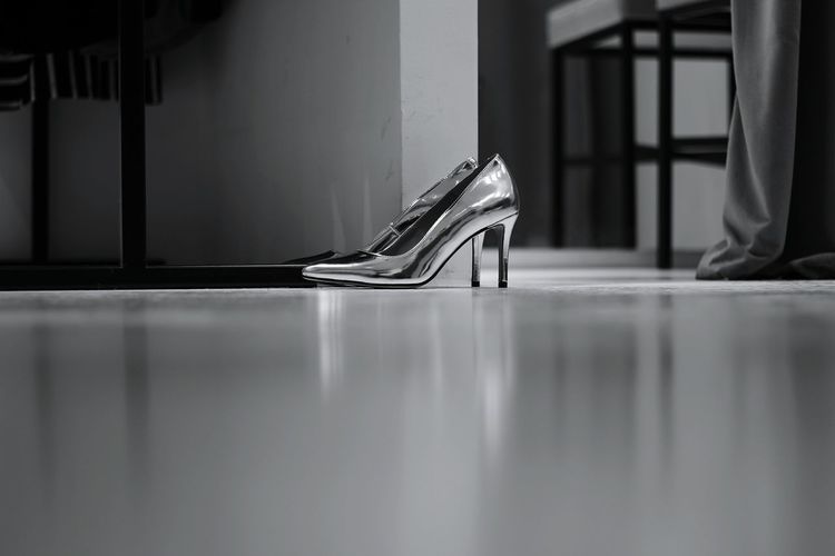 Surface level view of high heel shoes indoors
