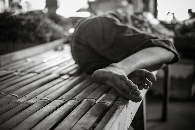 Man lying on bench