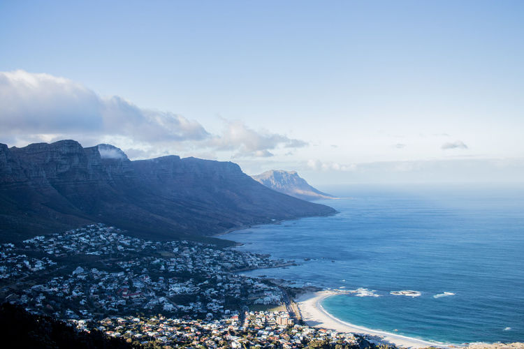 Scenic view of sea and mountains against sky in cape town near table mountain