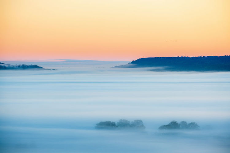 Awesome misty landscape view at dawn