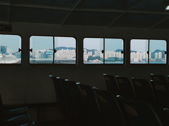 Empty seats in ferry with outside landscape