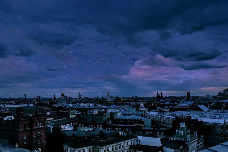 High angle view of illuminated cityscape against sky