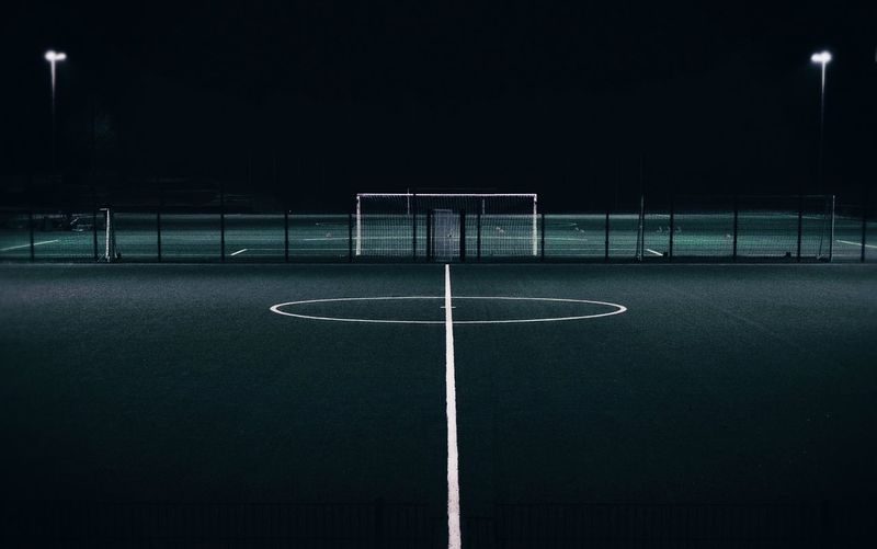 Empty illuminated court at night