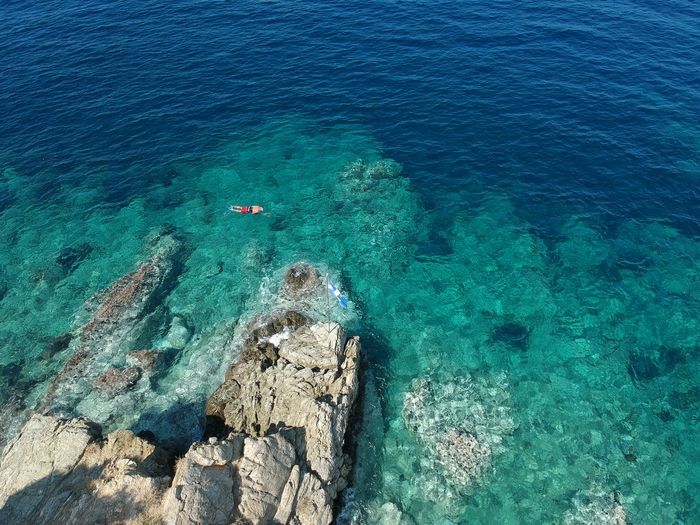 High angle view of rock formation in sea