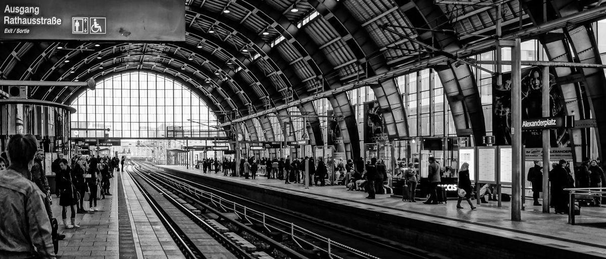 Commuters waiting on platform at berlin alexanderplatz station