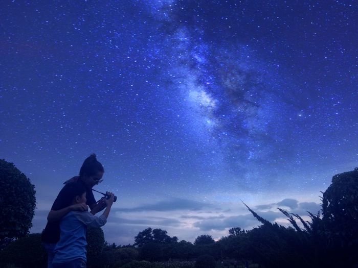 Mother with son against star field