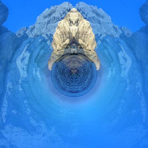 Digital composite image of ice against blue sky