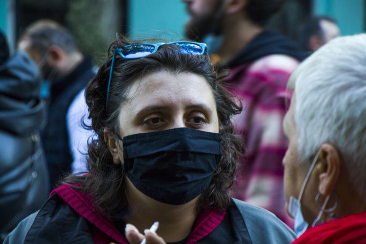 Georgian protests in front of the parliament of georgia, people with medical face masks.
