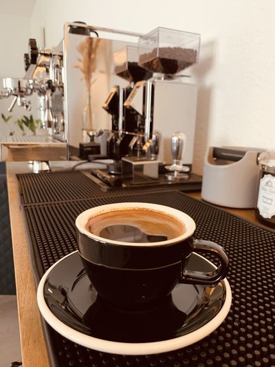 Close-up of coffee served on table at cafe
