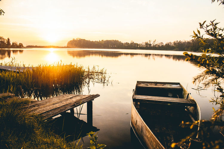 Scenic view of lake against sky during sunset