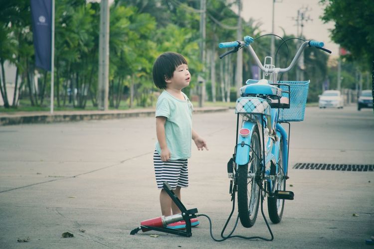 Boy bicycle on city street