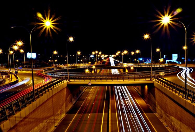 High angle view of illuminated highway at night