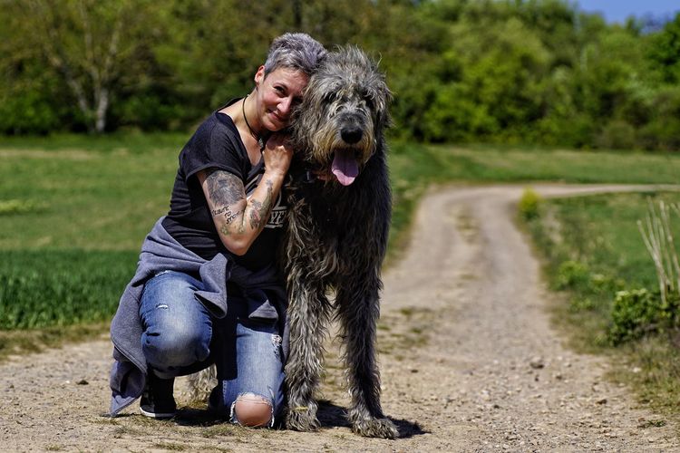 Woman posing with dog