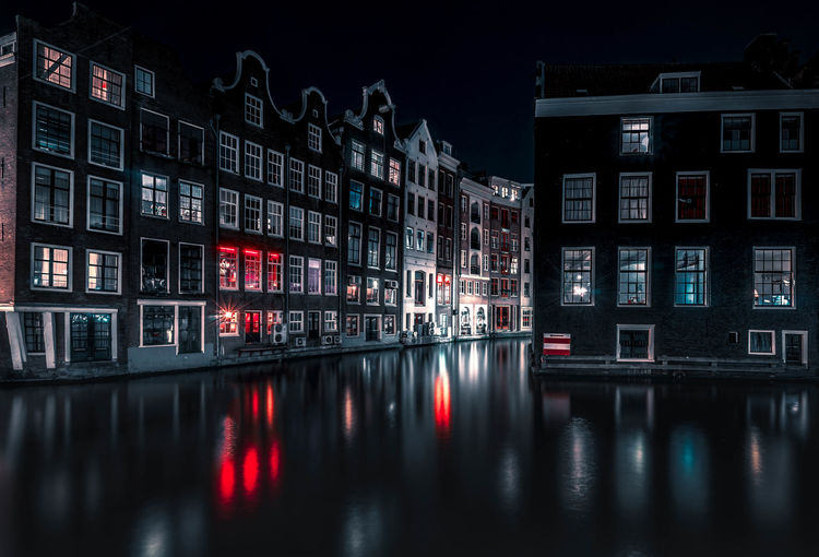 Reflection of illuminated buildings in water