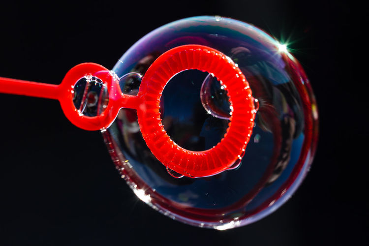 Close-up of bubble on wand outdoors