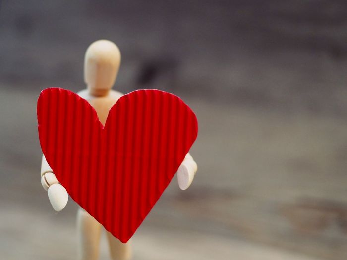 Close-up of heart shape made from red leaf