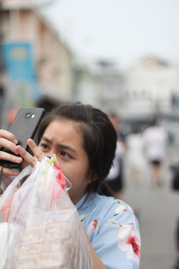 Close-up of woman using mobile phone